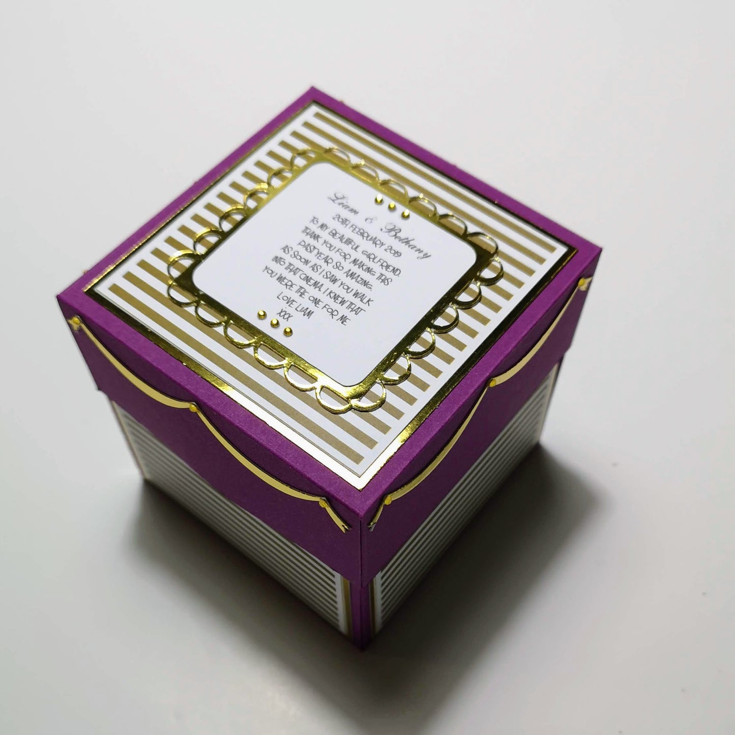 Exploding Memory Photo Box - Purple & Gold Stripes: A customizable, handcrafted explosion box with intricate patterns, revealing photo spaces and a pop-up centerpiece for enchanting memory display. Ideal for personal keepsakes.