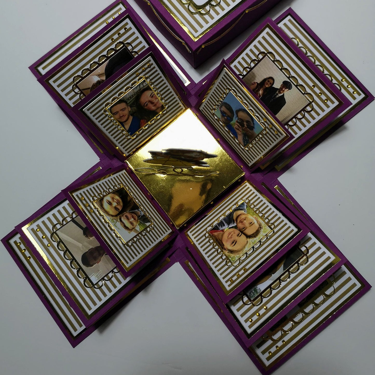 Exploding Memory Photo Box - Purple & Gold Stripes: A customizable, handcrafted photo box unfolds to reveal intricate patterns, a dynamic pop-up centerpiece, and ample photo spaces for cherished memories.