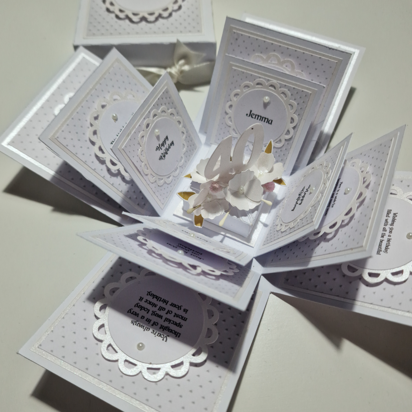 Embossed Elegance Birthday Celebration Pop-Open Box Card showcasing intricate embossed designs, featuring celebratory elements like balloons and confetti. Ideal for a unique birthday greeting.