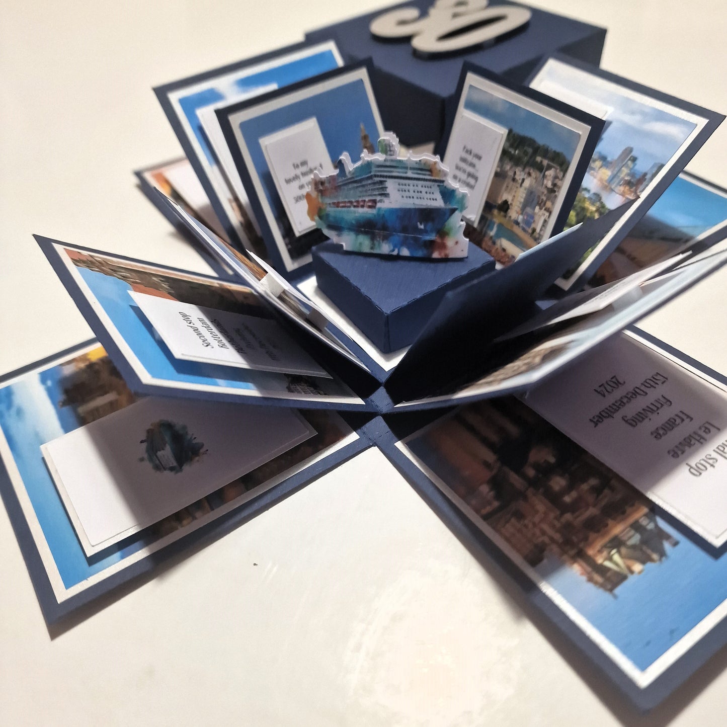 New York - Black & Gold - Surprise Special Occasion | Celebration Trip Reveal Explosion Box featuring intricate paper panels with a Statue of Liberty centerpiece, designed for a unique trip announcement experience.