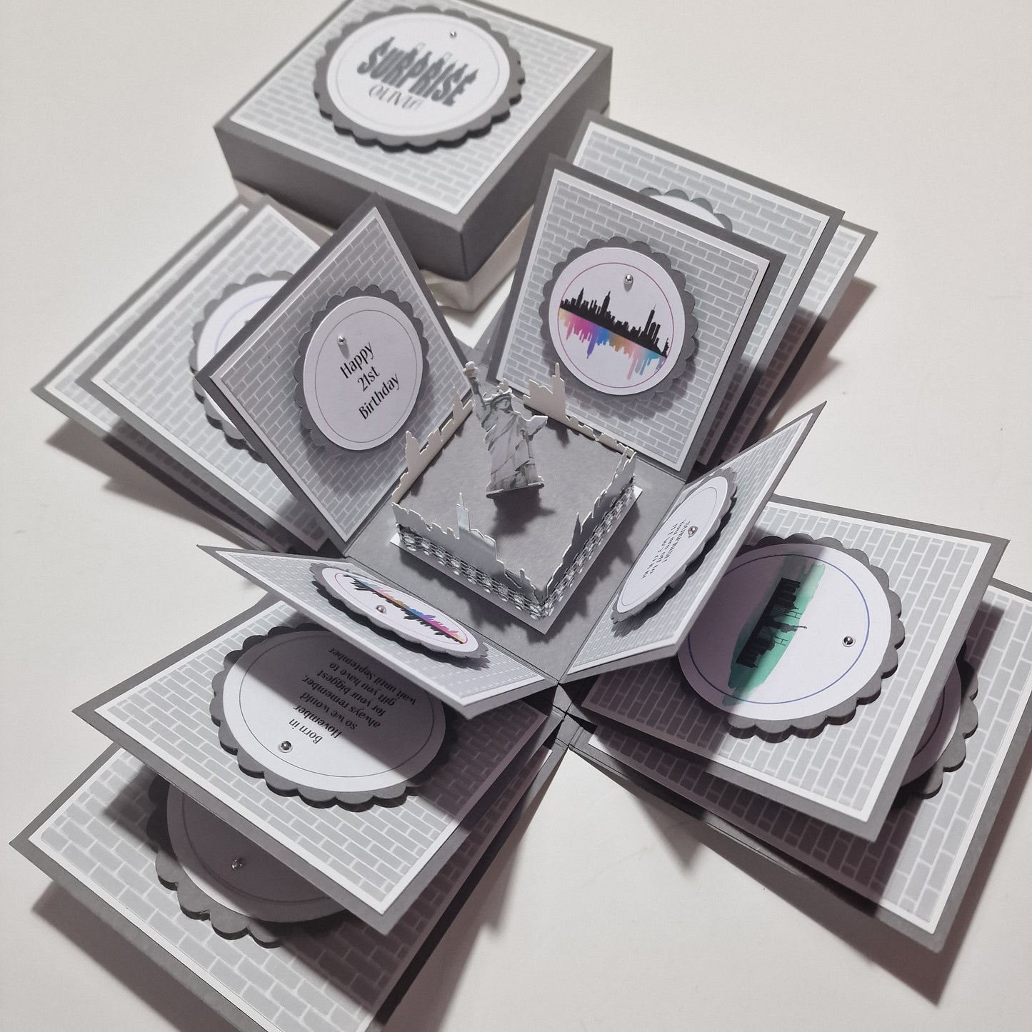 New York - Silver Grey Graffiti Styled - Surprise Special Occasion | Celebration Trip Reveal Explosion Box featuring intricate subway tile and graffiti panels, with a central freestanding Statue of Liberty and New York skyline.