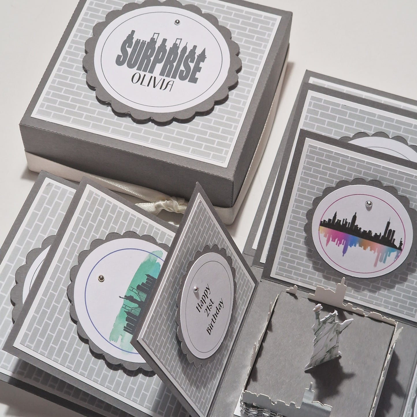 New York - Silver Grey Graffiti Styled - Surprise Special Occasion | Celebration Trip Reveal Explosion Box featuring subway tile and iconic architecture panels with a freestanding Statue of Liberty and New York skyline centerpiece.