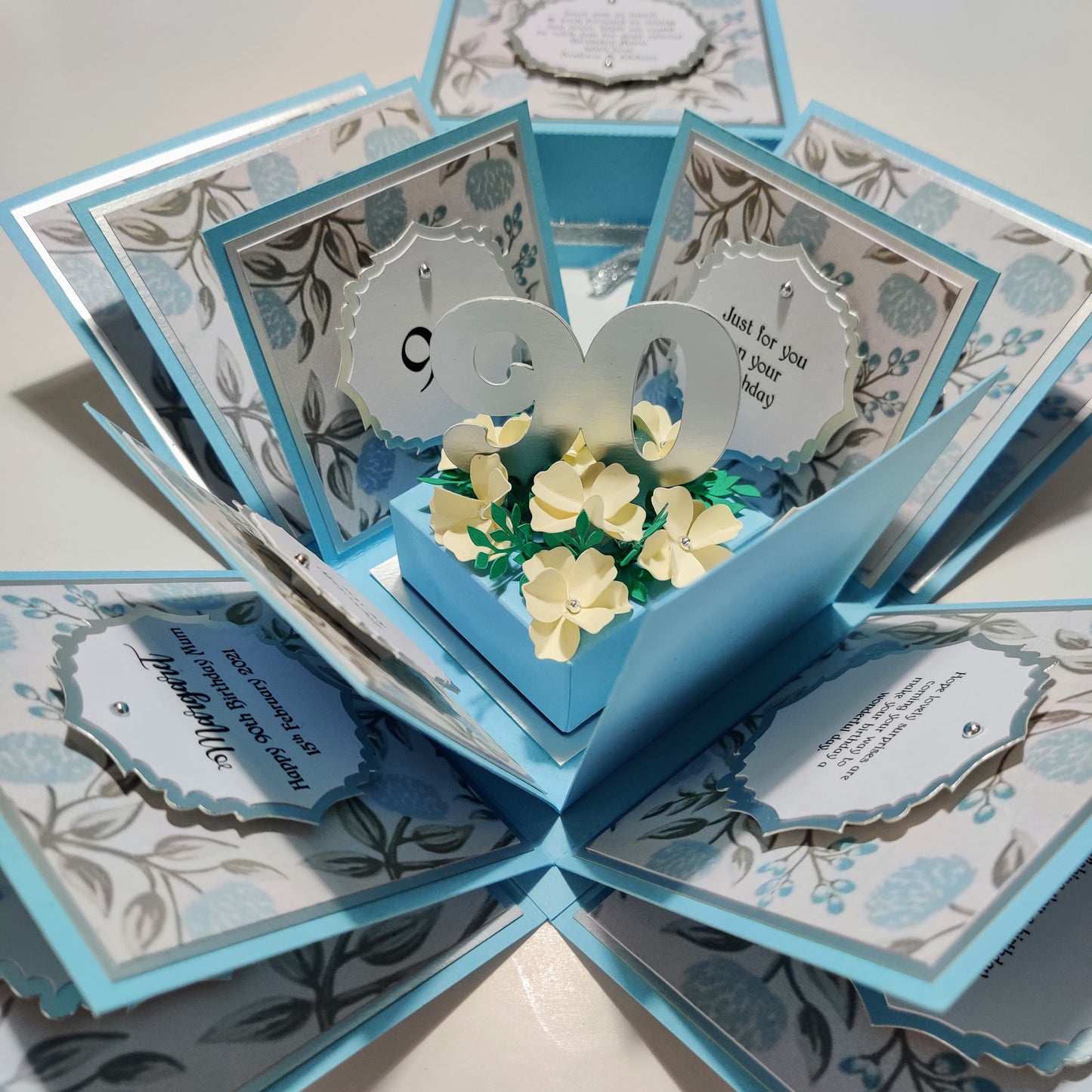 Pastel Blue Florals Birthday Celebration Pop-Open Box Card featuring a charming floral design, ideal for adding a surprise element to any birthday celebration with its unique pop-open feature.