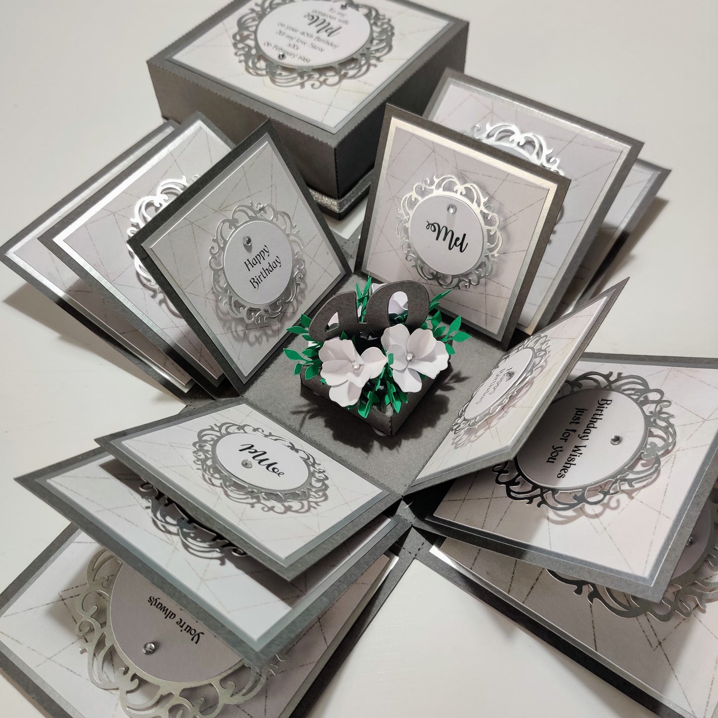 Grey & Silver Geometrics Birthday Celebration Pop-Open Box Card featuring intricate geometric patterns and celebratory elements, designed to pop open for a dynamic presentation. Ideal for sending festive birthday greetings.