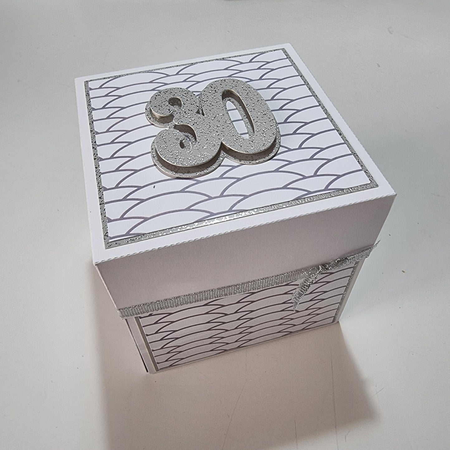 Exploding Memory Photo Box - Silver Scalloped Waves, featuring elegant silver accents and a central “30” champagne bottle cutout, showcasing personal photos and messages for milestone celebrations.