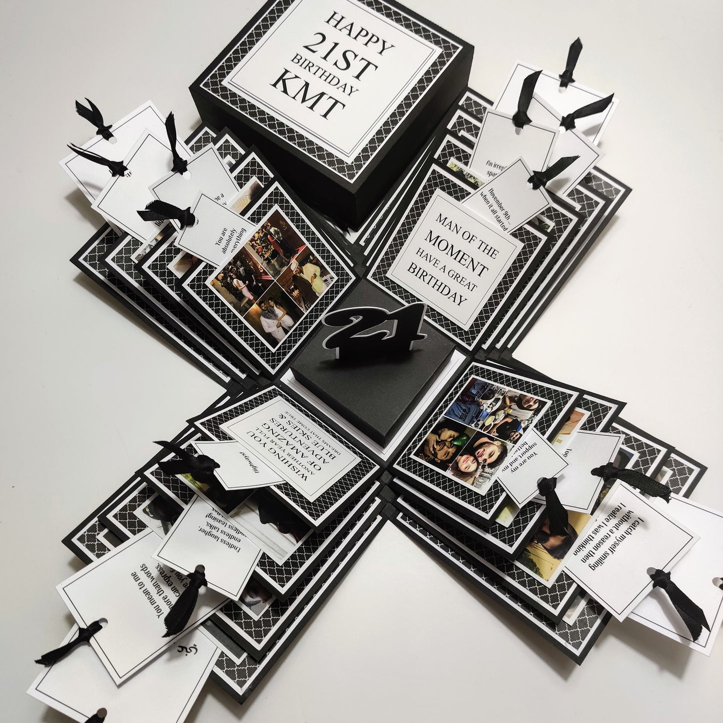 Exploding Memory Photo Box - Surprise Gift - Keepsake Album Box, showcasing a black-and-white retro design with geometric patterns, interactive layers, ribbon-secured photo slots, and a special central compartment.