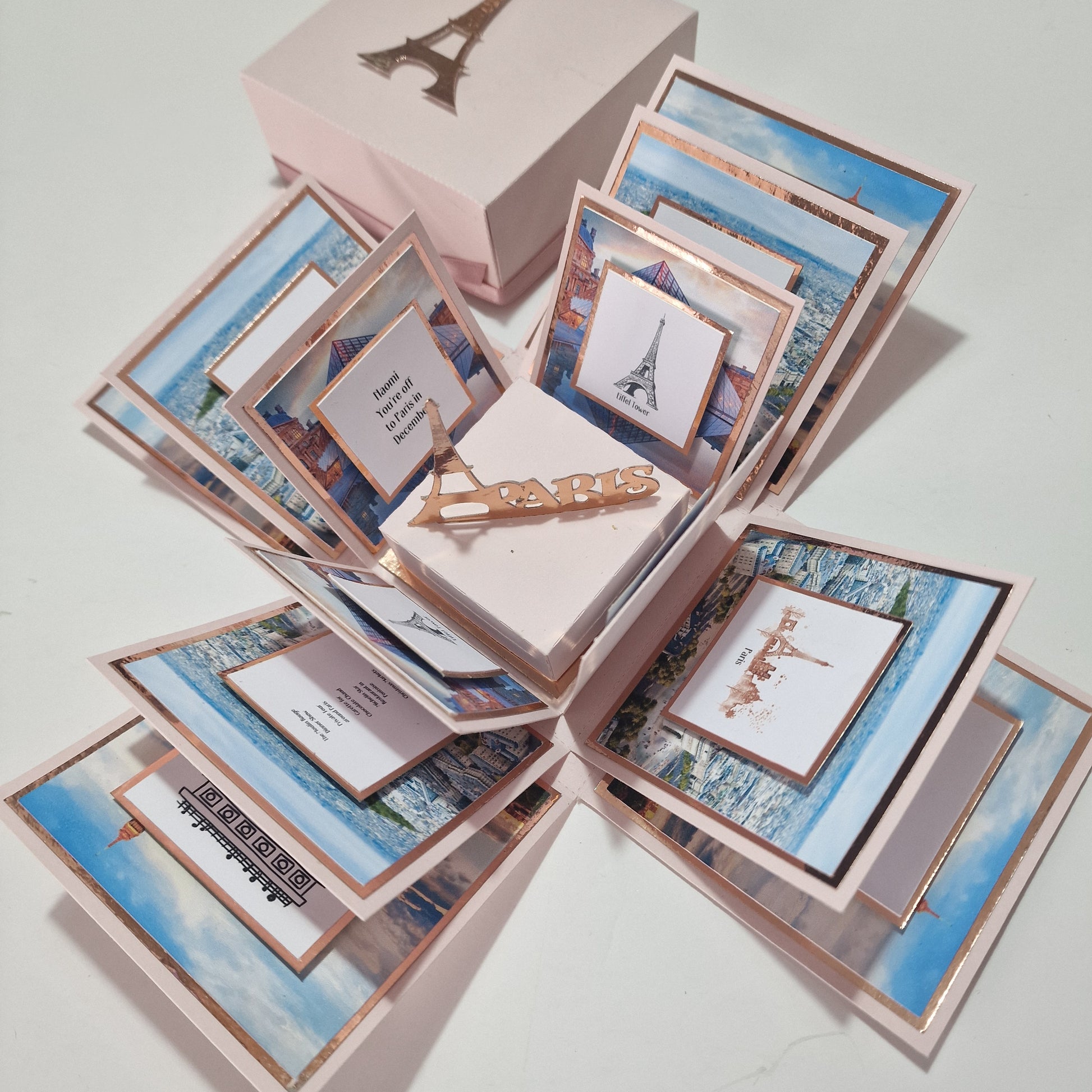 Paris - Special Occasion Celebration Trip Reveal Explosion Box featuring a freestanding Eiffel Tower. Includes landscape and architecture panels with personalized event details cleverly integrated into the box design.