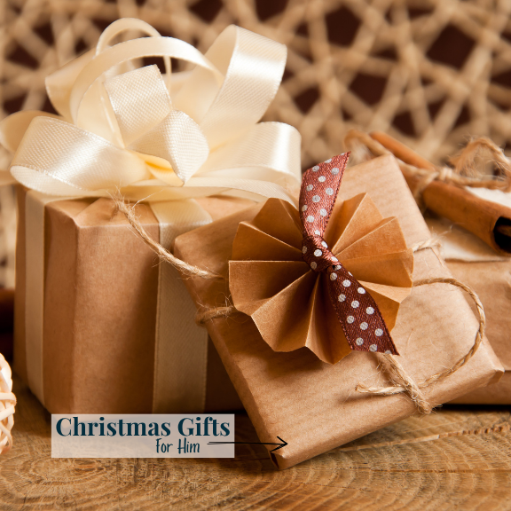 Two brown paper-wrapped gifts with decorative bows on a wooden surface, labeled 'Christmas Gifts for Him'.