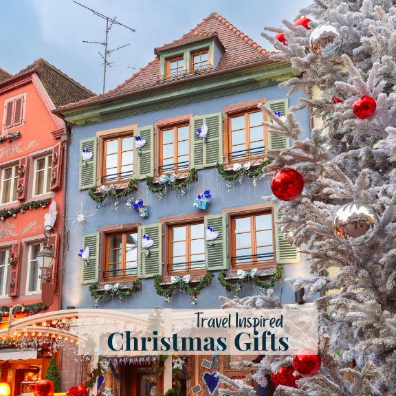 Decorated Christmas tree with a festive street scene in the background