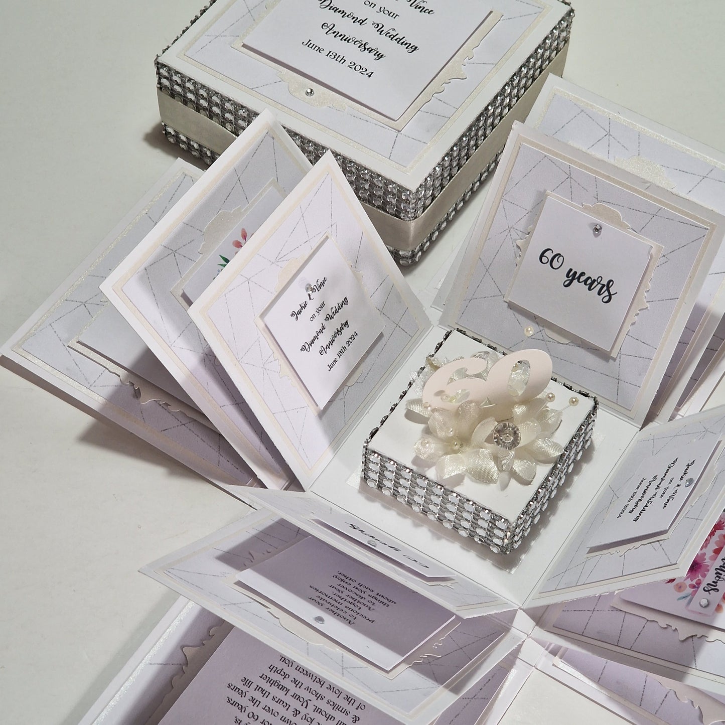 Diamond Wedding Anniversary Exploding Box with floral and diamond-inspired design, featuring personalized messages inside. A unique keepsake celebrating 60 years of marriage, crafted from white cardstock with pearlescent mounts.