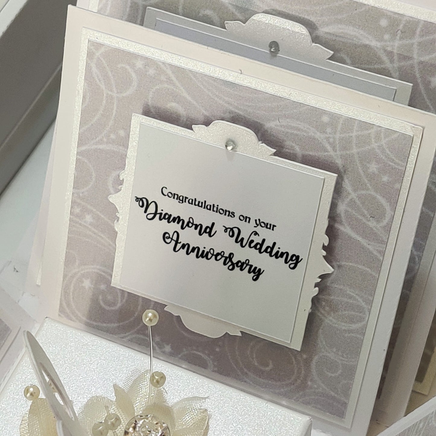 Diamond Wedding Anniversary Exploding Box with white floral accents, features personalized panels for a memorable keepsake, celebrating 60 years of love.