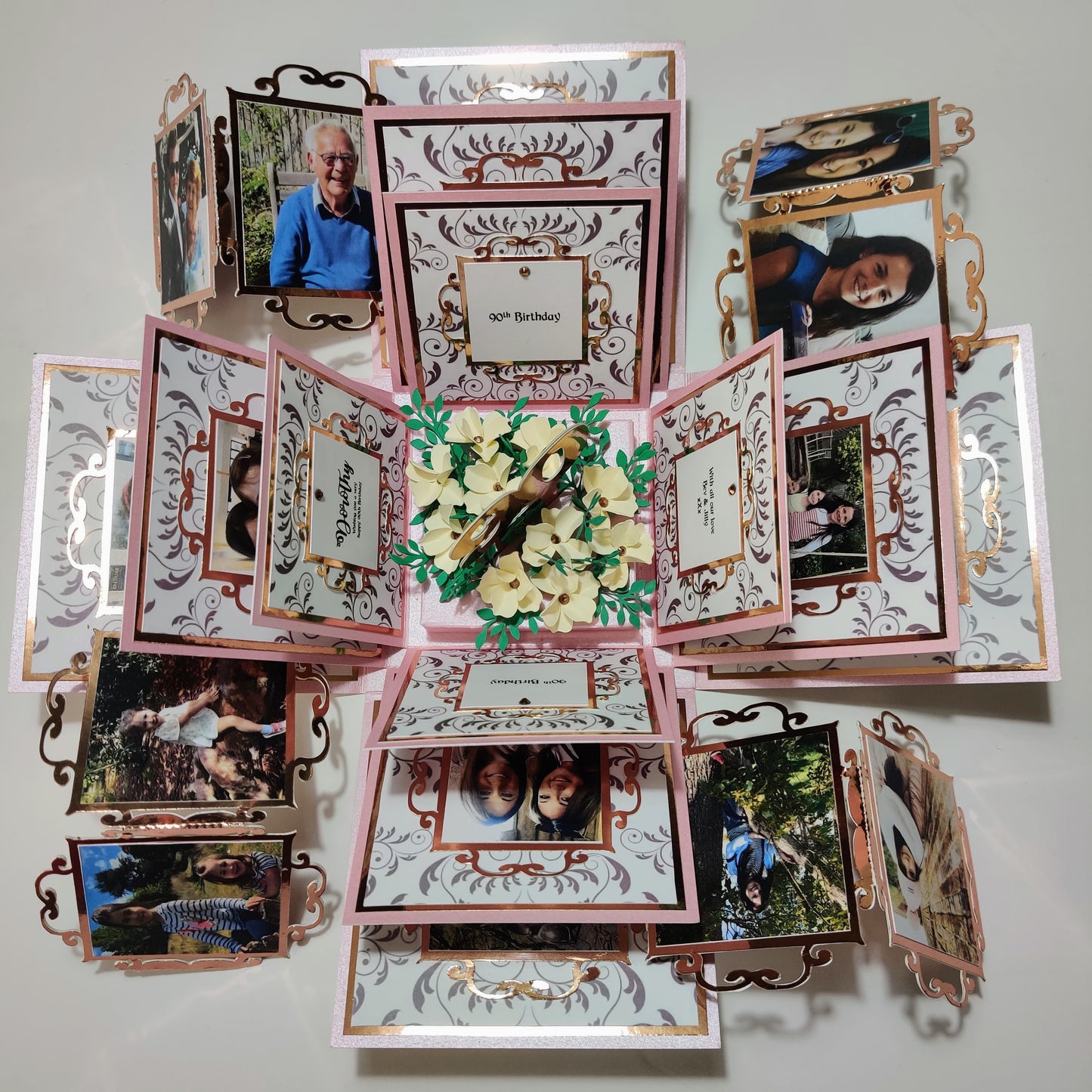 Exploding Memory Photo Box displaying multiple layers, flip albums, and pockets, designed for keepsakes. Available in various sizes and customizable with themes like Purple Swirls or Black & White Retro.