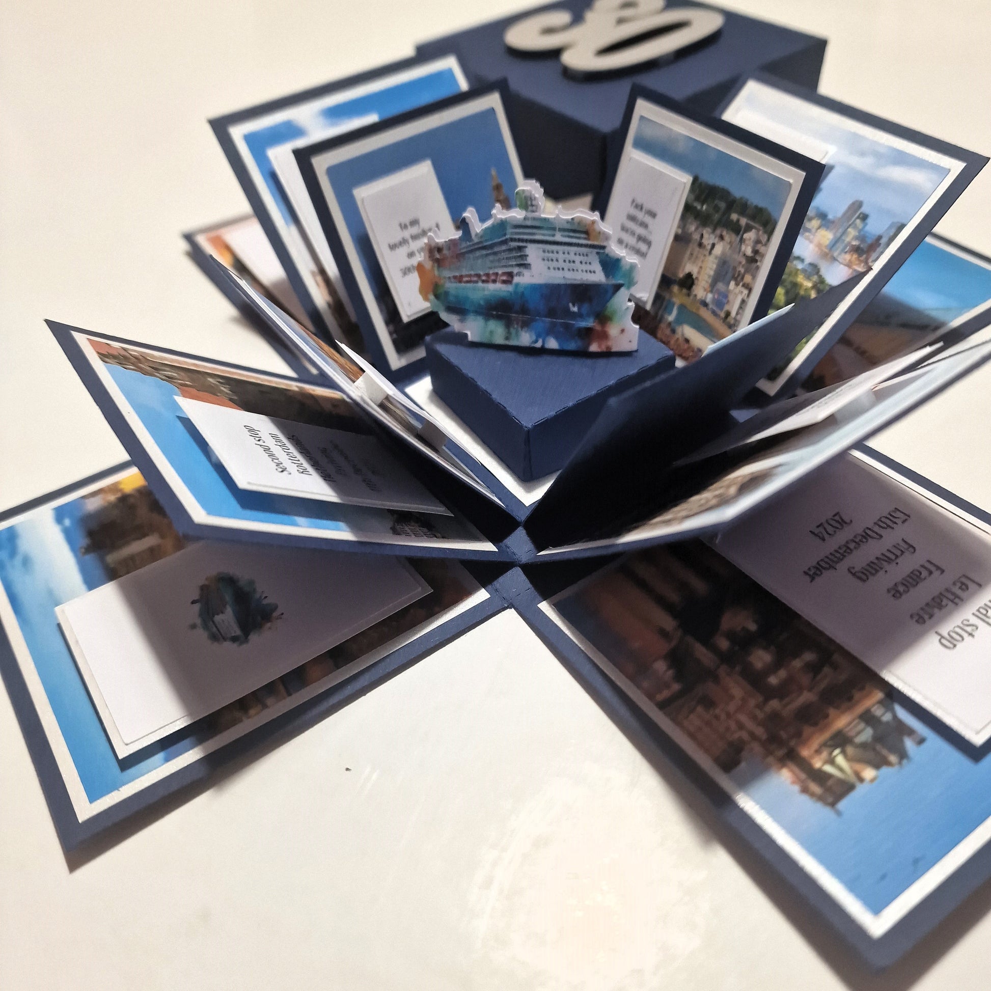 New York - Black & Gold - Surprise Special Occasion | Celebration Trip Reveal Explosion Box featuring intricate paper panels with a Statue of Liberty centerpiece, designed for a unique trip announcement experience.