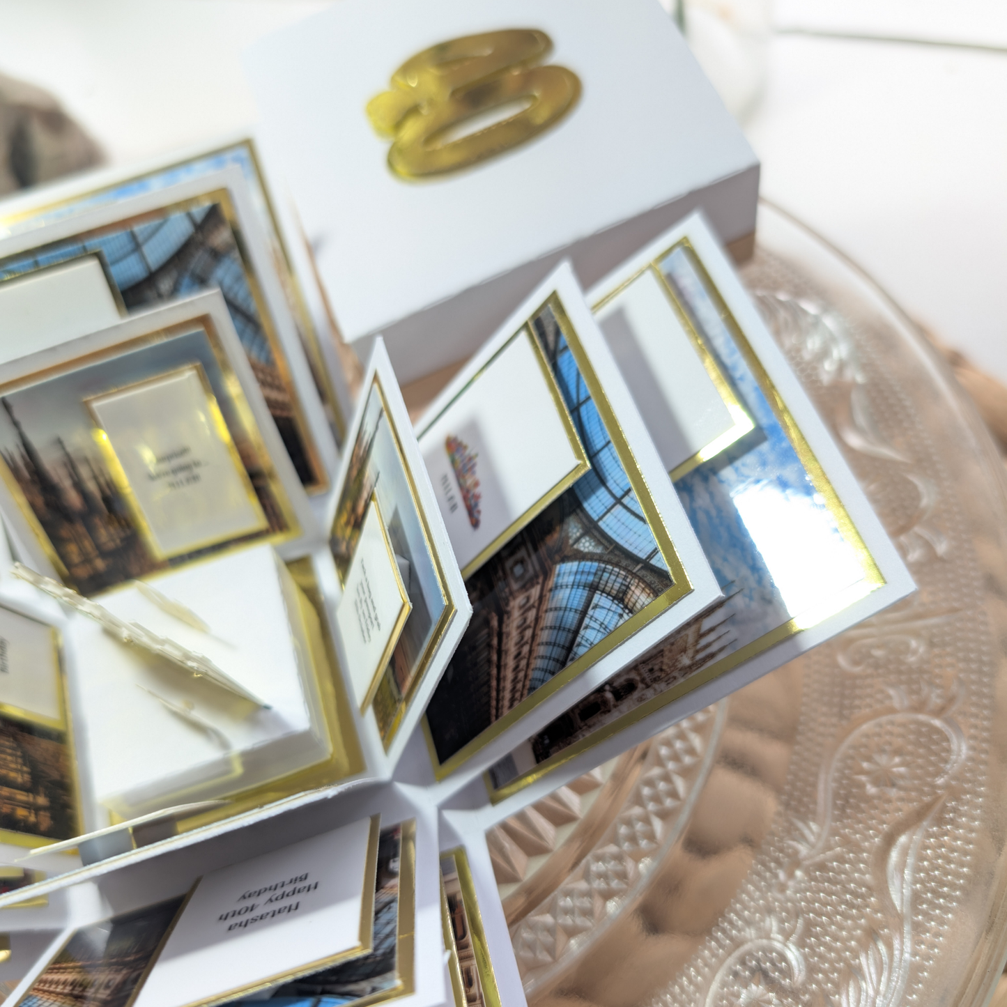 New York - Silver Grey Graffiti Styled - Surprise Special Occasion | Celebration Trip Reveal Explosion Box, featuring gold-foil 30, pop-up flaps with NYC-themed photos on a decorative cake stand.