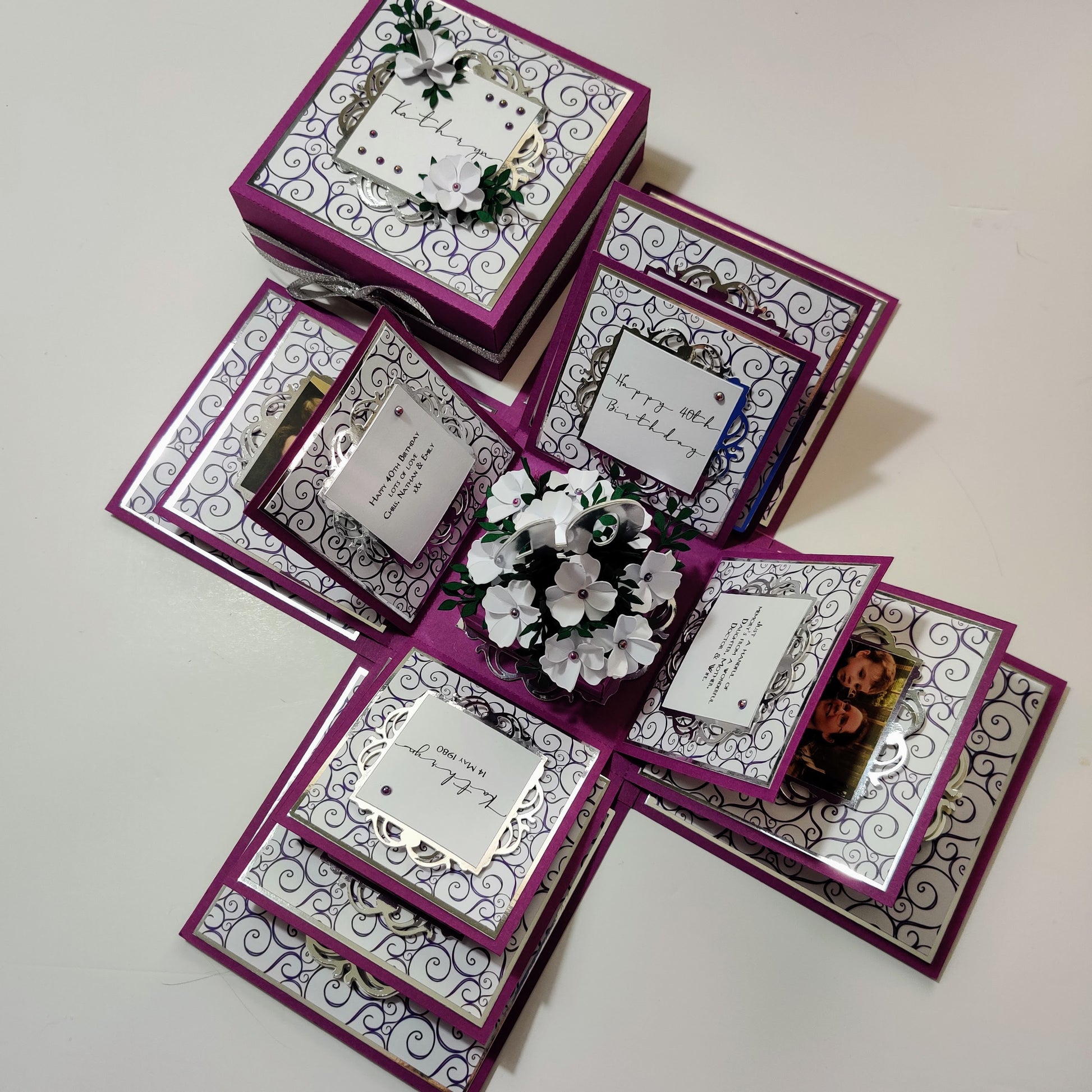 Exploding Memory Photo Box - Purple with Silver Swirls, showcasing customizable panels for photos, with a central compartment for a gift or photo cube, designed to display up to 80 photos.