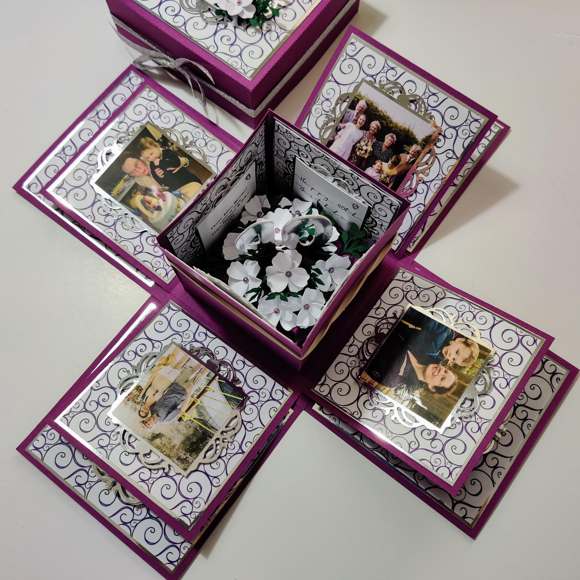 Exploding Memory Photo Box - Purple with Silver Swirls, designed to hold up to 80 photos, featuring customizable panels for personal photos and a center space for a gift or photo cube.