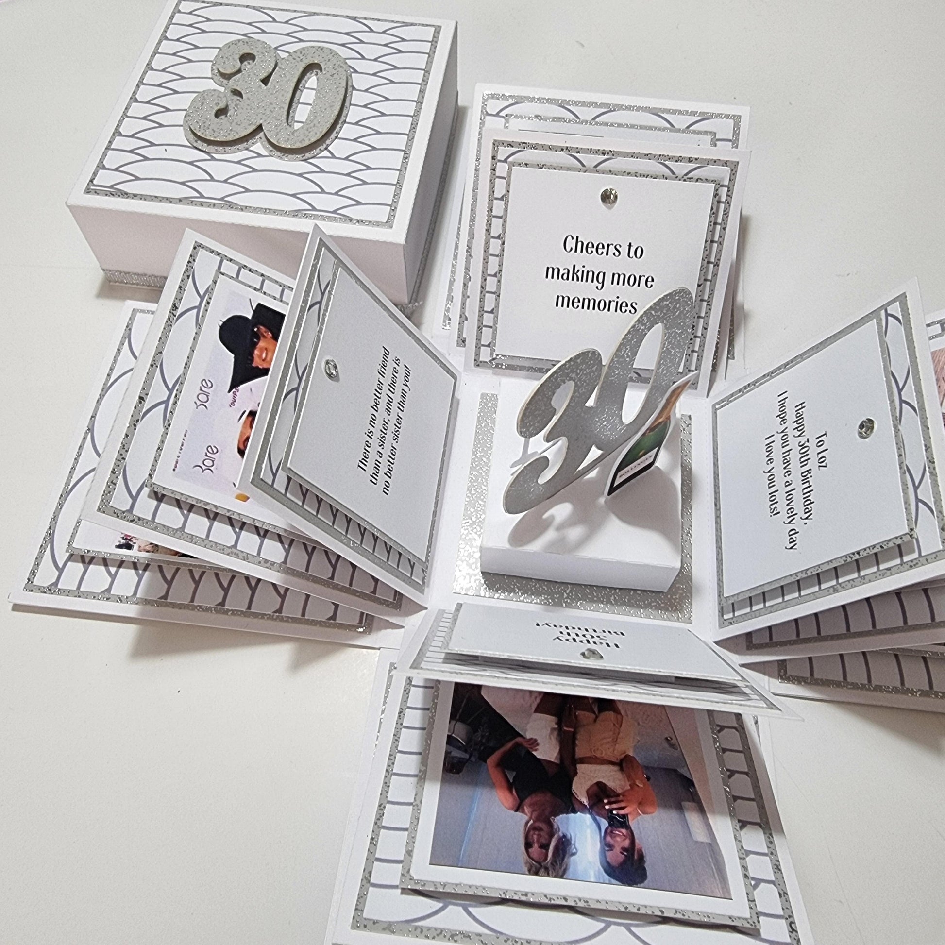 30th Birthday Celebration Occasion Box ~ White & Silver featuring silver numbers, pictures of people, and personalized birthday messages, designed with geometric printed papers for a delightful birthday surprise.