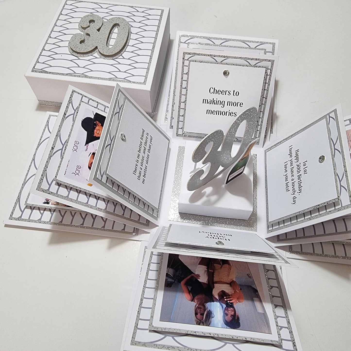 Exploding Memory Photo Box - Silver Scalloped Waves showcasing an elegant design with silver wave accents, a 30 centerpiece, and photo panels for cherished milestone celebrations.