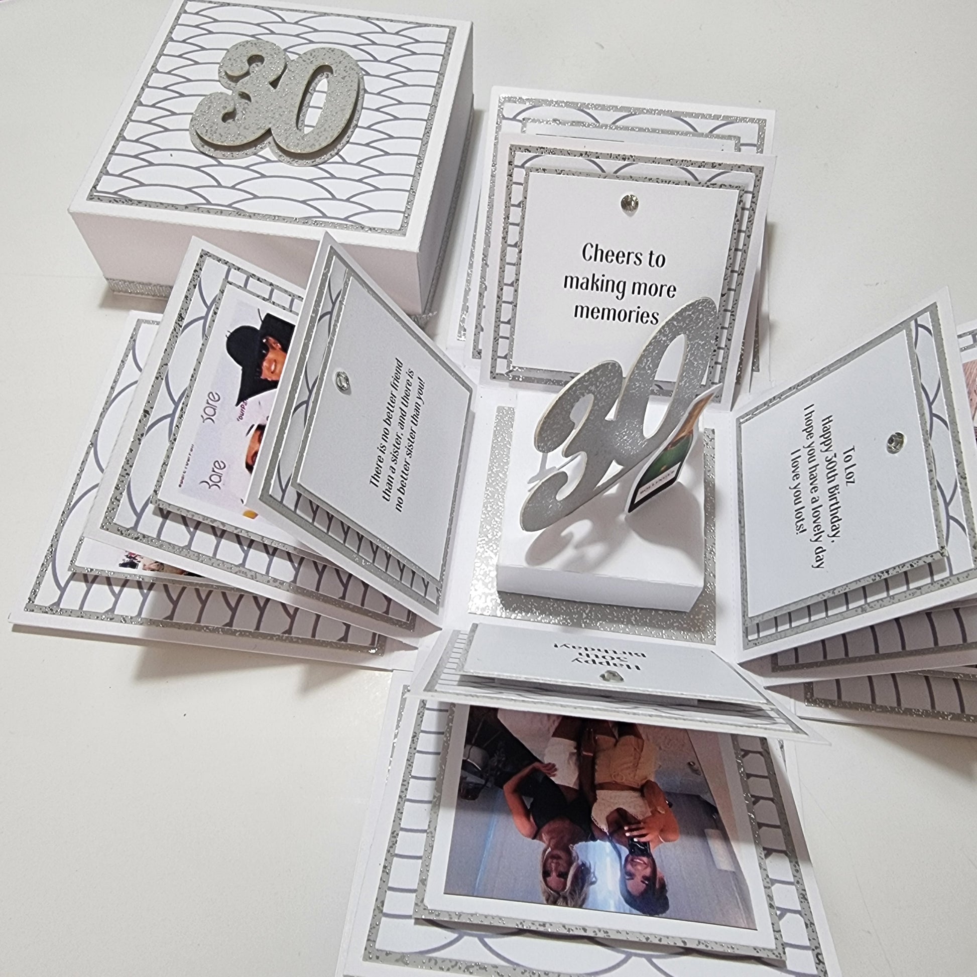 Exploding Memory Photo Box - Silver Scalloped Waves showcasing an elegant design with silver wave accents, a 30 centerpiece, and photo panels for cherished milestone celebrations.