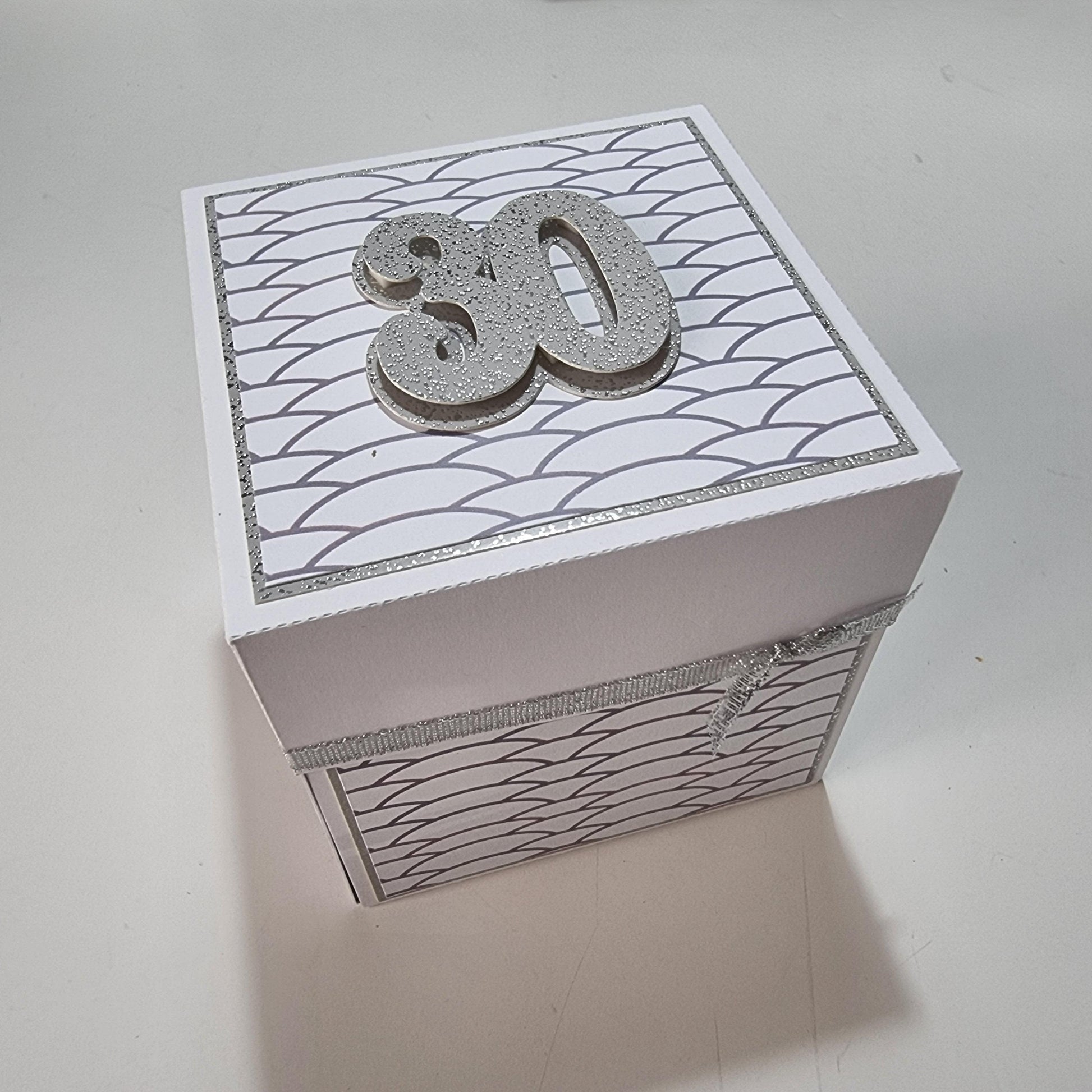 30th Birthday Celebration Occasion Box ~ White & Silver featuring a white container with a prominent number, elegantly decorated with geometric patterns, perfect for gifting personalized birthday messages and celebrations.