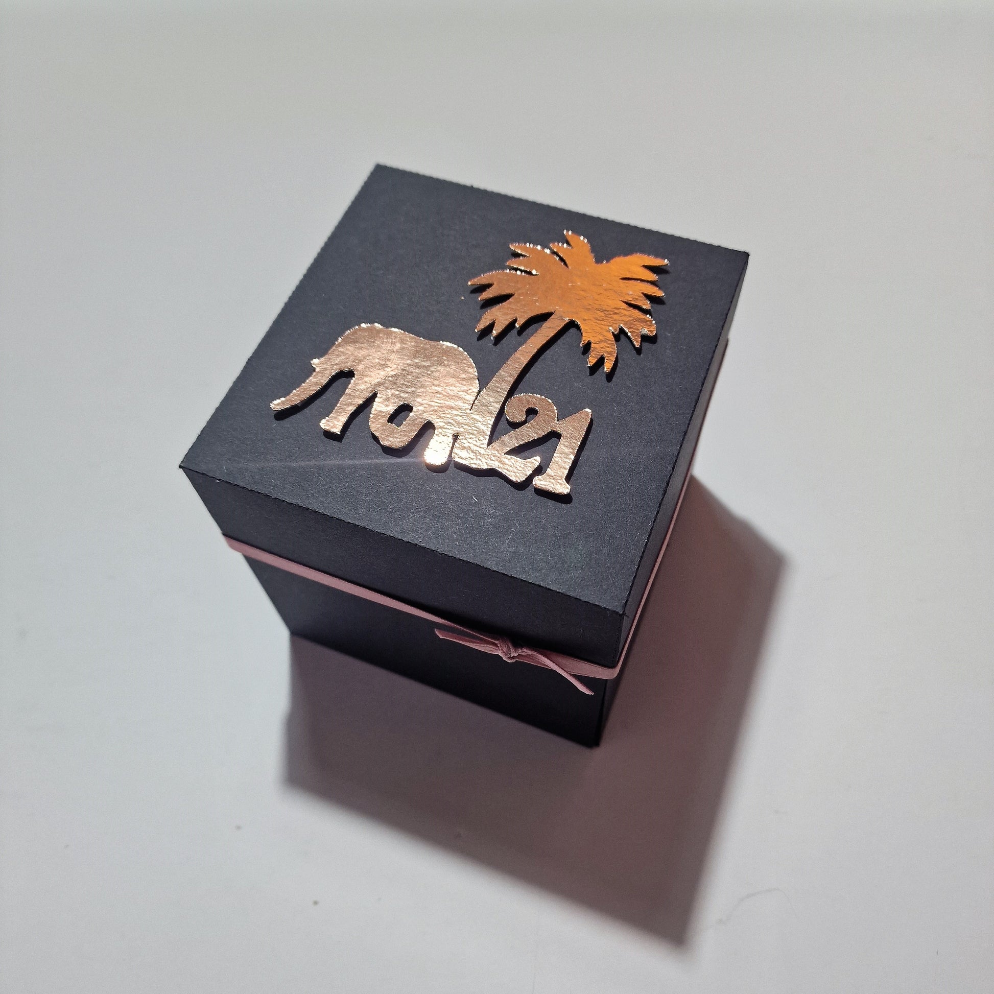 Black Exploding Thailand Trip Reveal Box with Rose Gold Accents. Contains all the relevant trip information