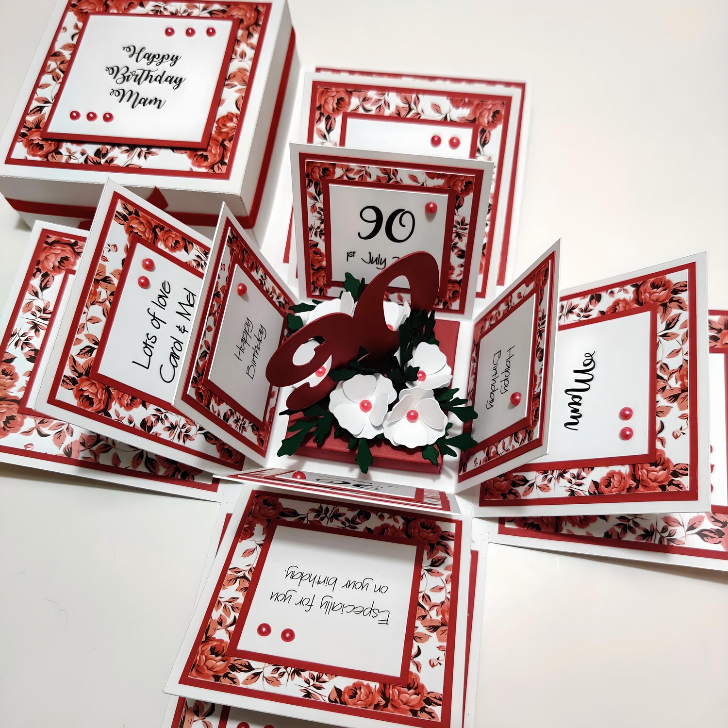 White Exploding Birthday Celebration Box Card with Red rode Panels & Red Accents. White forget me knot flowers form the centre around an appropriate age